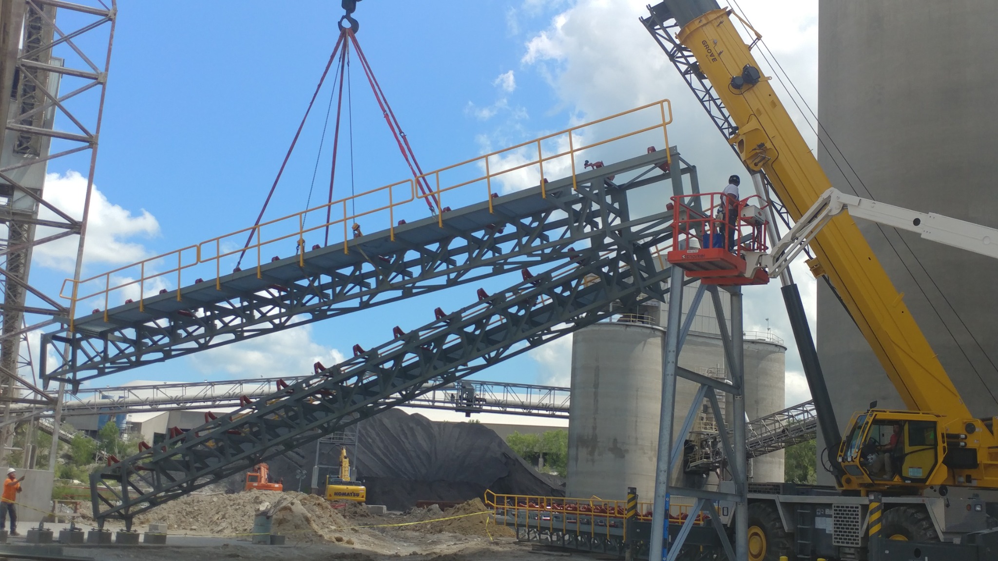 Lifting a conveyor support structure into position.