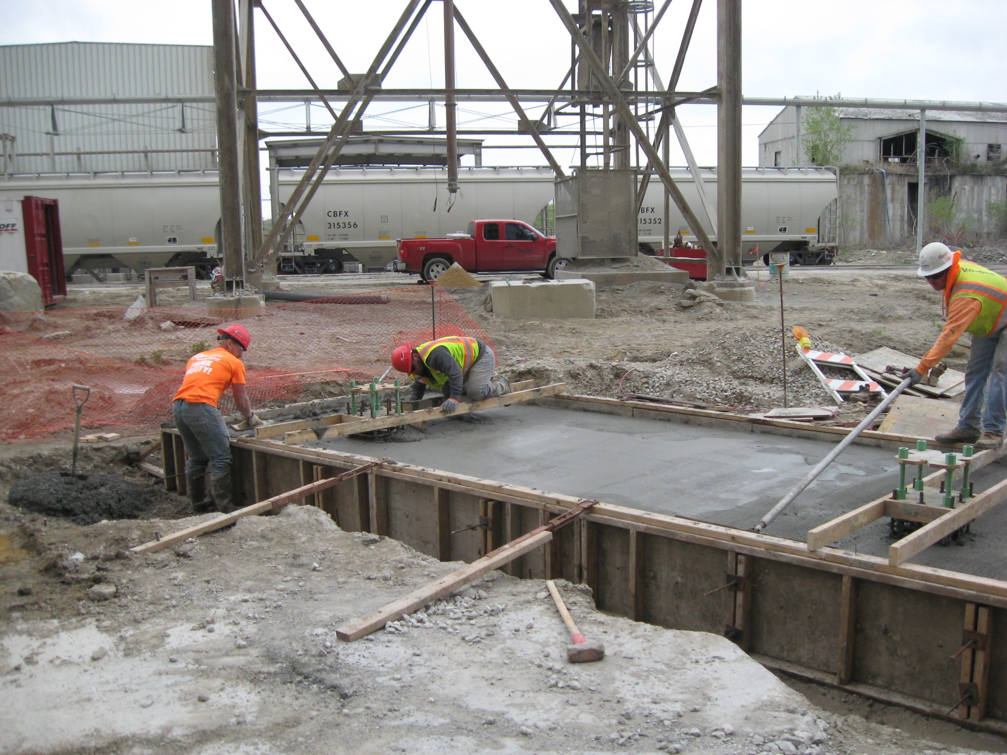 Concrete finishing and anchor-bolt setting.